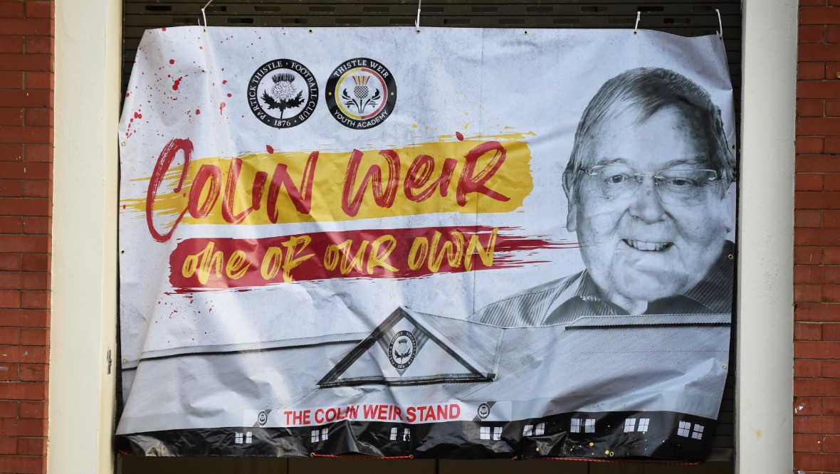 A banner outside the ground celebrates the life of Colin Weir. Pic: SNS