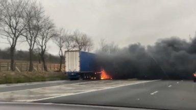 Fire engulfs lorry as it bursts into flames on busy M8