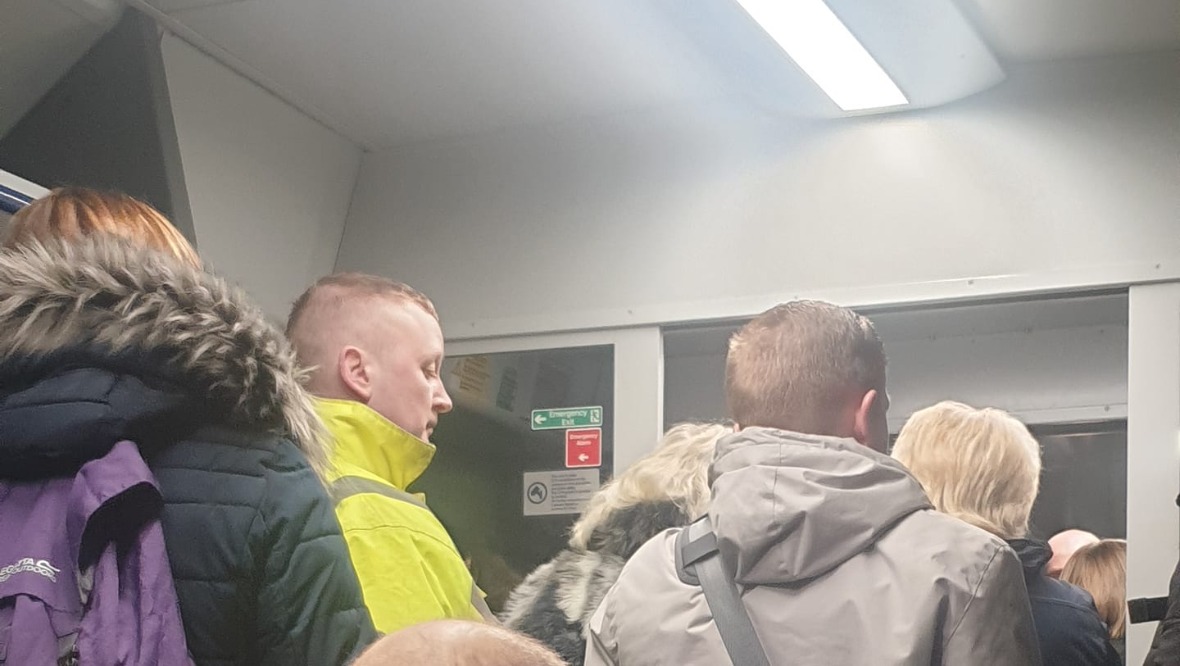 Overloaded: People could be seen standing on a service from Motherwell to Dalmuir. <strong>Kevin Hughes</strong>”/><cite class=cite></cite></div><figcaption aria-hidden=true>Overloaded: People could be seen standing on a service from Motherwell to Dalmuir. <strong>Kevin Hughes</strong> <cite class=hidden></cite></figcaption></figure><p>Kevin Hughes, a department manager at a supermarket, was travelling from Motherwell to Dalmuir at 6.44am and was shocked to see cramped conditions on his train.</p><p>“Personally I just don’t understand the logic behind it,” he said. “Surely the trains should be more frequent, so fewer passengers are spread across more trains.</p><p>“Also train times for old schedule are still live both on websites and train platform monitors.</p><figure class=