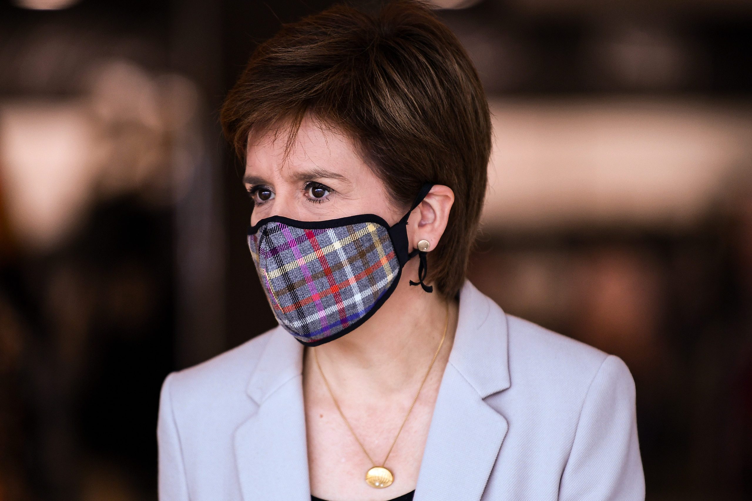 Nicola Sturgeon apologised after breaching Covid rules by taking off her face mask at a wake.