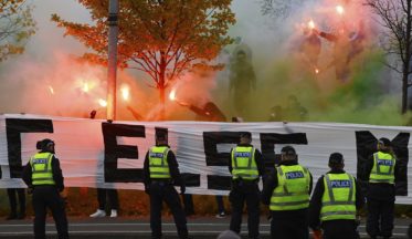 Fans gathered outside Celtic Park and released pyrotechnics