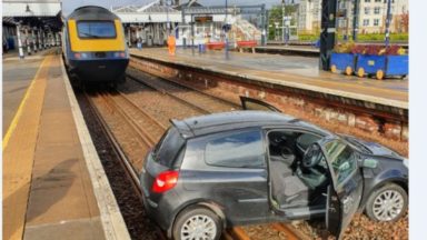 Train delays after car blocks railway line at station