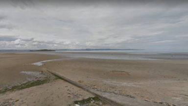 Bid to identify man after body found near beach