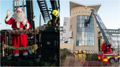 High-rise Santa lifts spirits at children’s hospital window