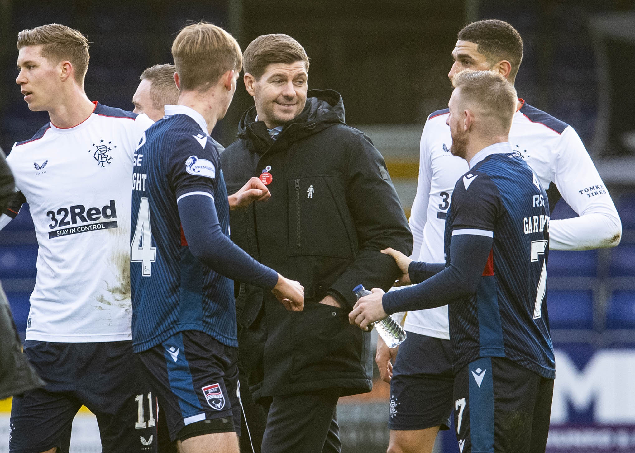 Steven Gerrard speaks to Michael Gardyne at full-time.