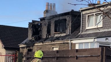 Woman, 82, dies in house fire as neighbours evacuated