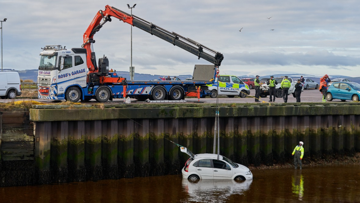 Man rescued from water after car plunges into harbour