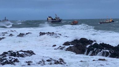 Epic rescue to save crew and boat from crashing into rocks