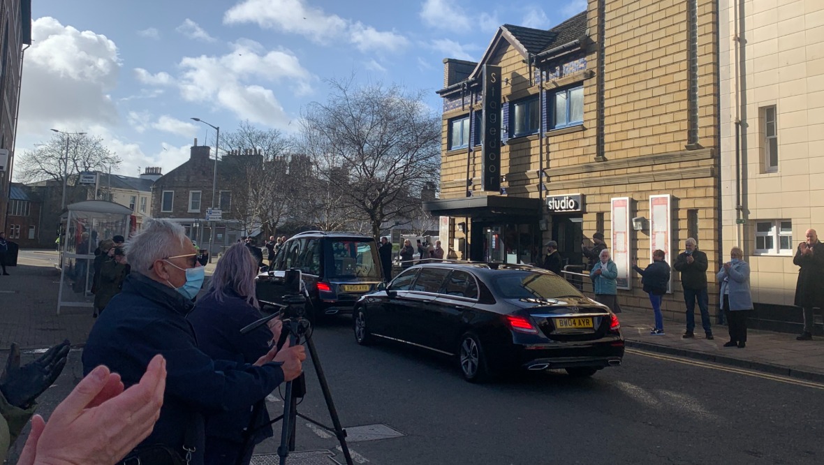 People gathered to applaud the late star outside The Gaiety Theatre.