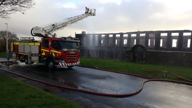 Planners urge rejection of permit to demolish fire-hit school