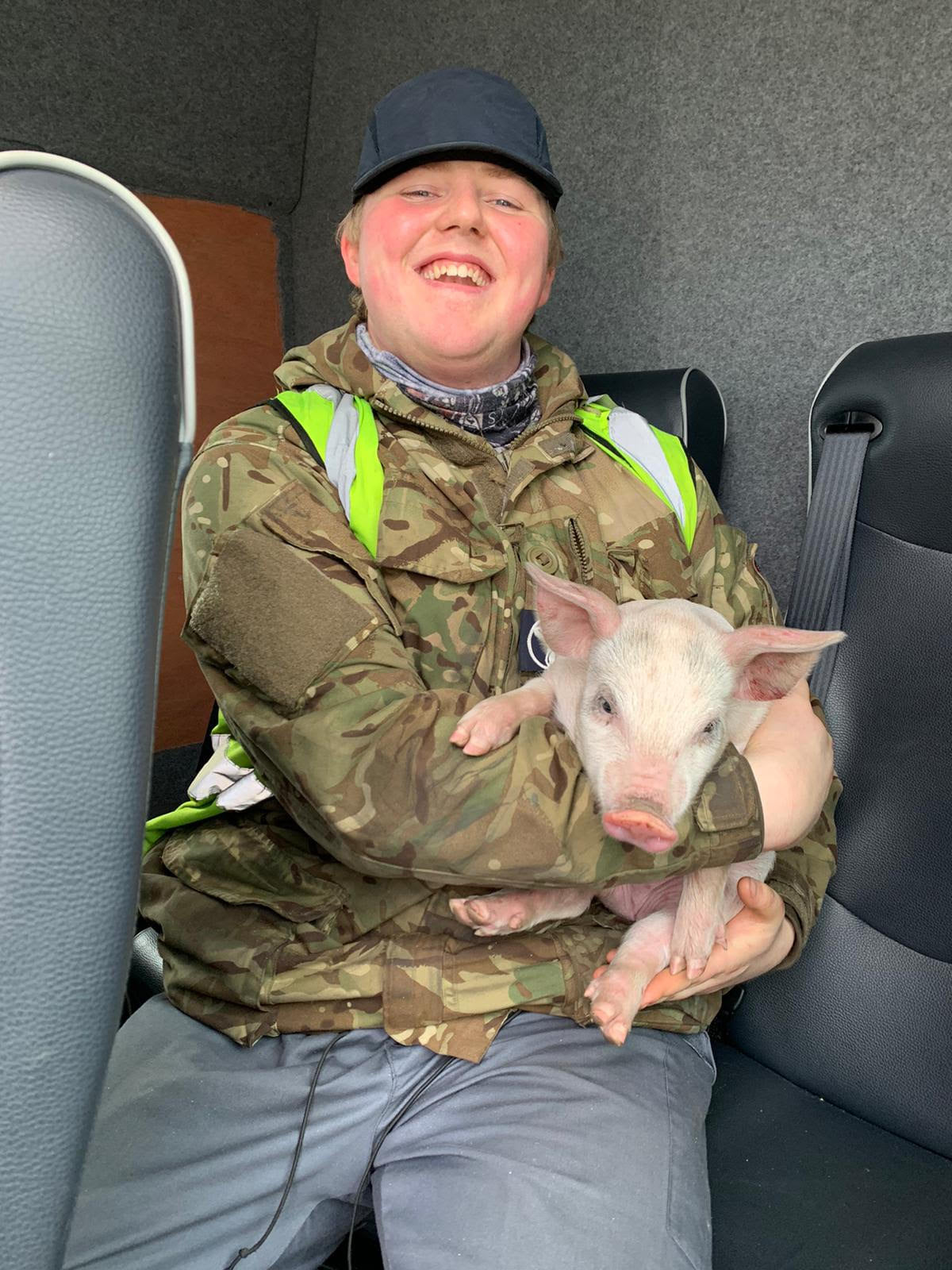 Engineer SAC(T) George French rescued the pig from the runway where he had tried to join pilots (RAF Lossiemouth/Facebook)