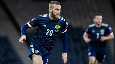 Scotland player Oli McBurnie facing assault charges after ‘stamping on rival fan’ amid pitch invasion