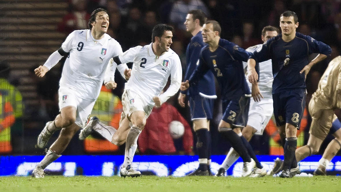 Christian Panucci celebrates his winning goal for Italy with team-mate Luca Toni.