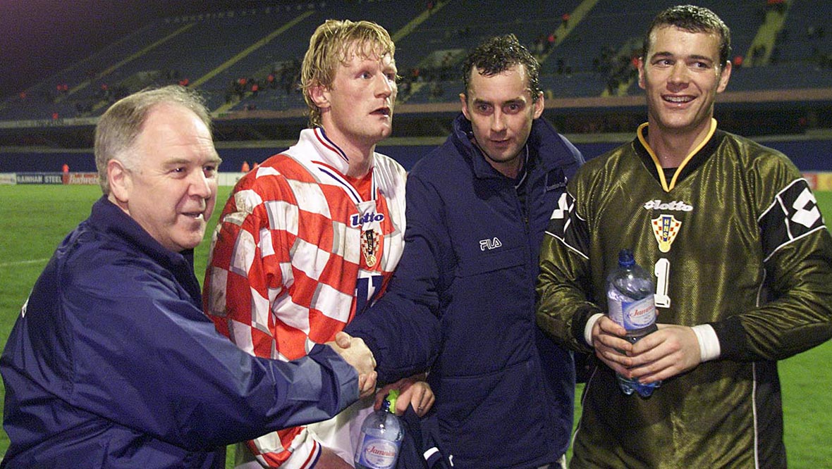 Craig Brown congratulates Don Hutchison after the final whistle in Zagreb as Colin Hendry and Neil Sullivan look on.