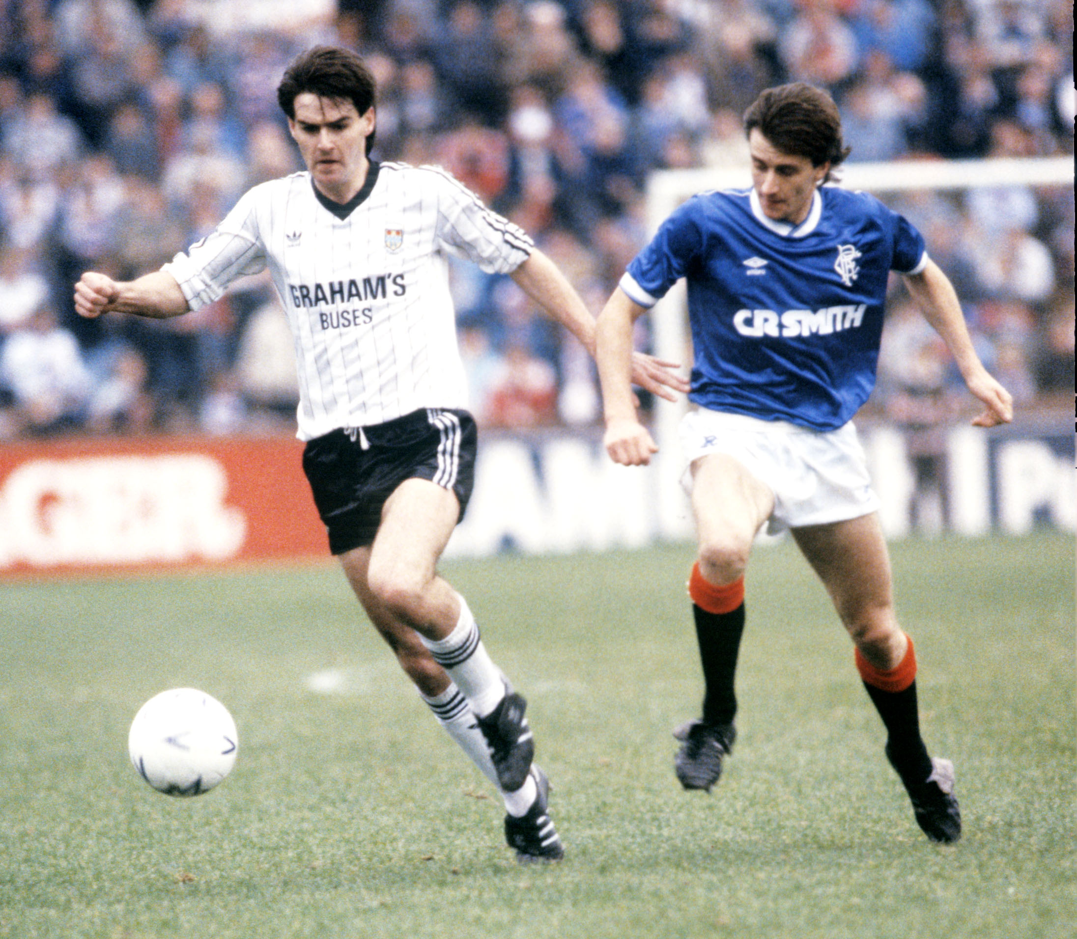 Steve Clarke breaks away from Bobby Russell for St Mirren v Rangers in 1985.