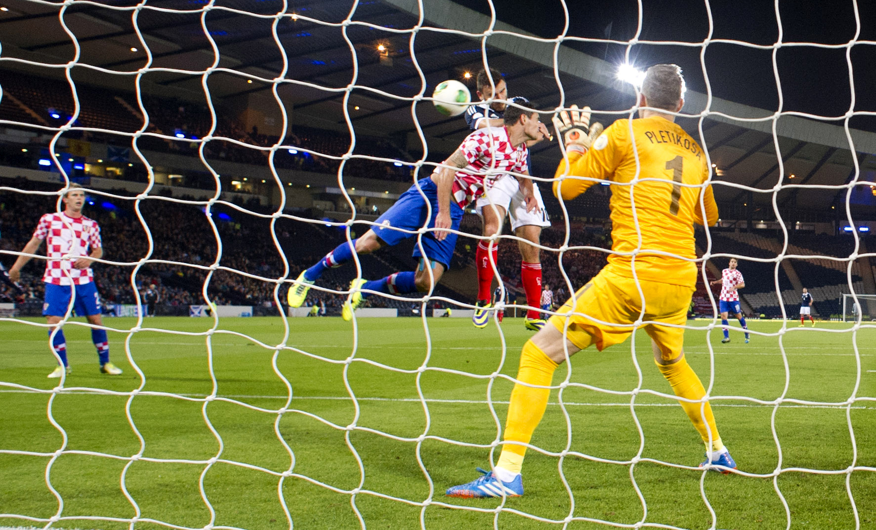 Robert Snodgrass rises above Ognjen Vukojevic to open the scoring.