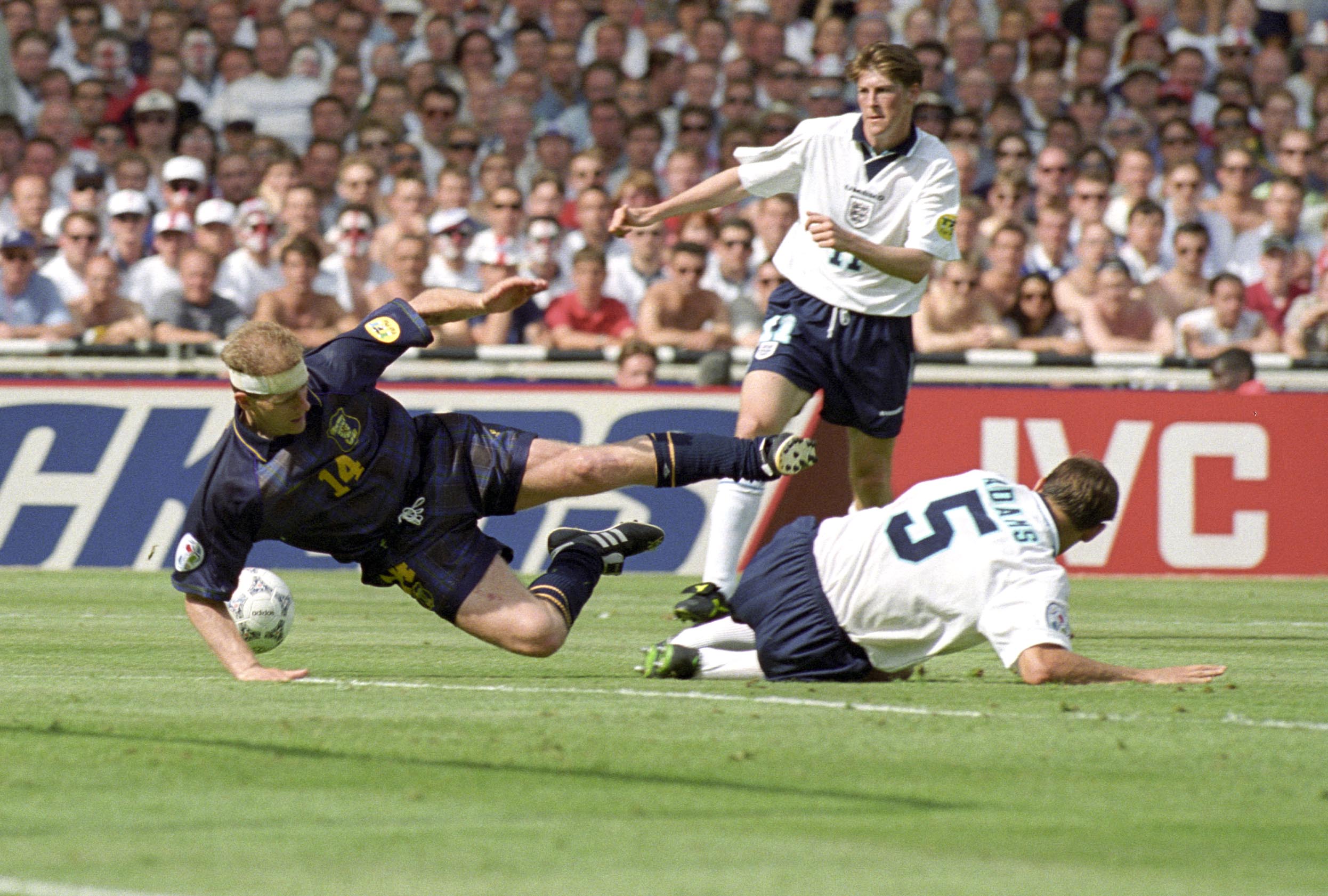 Gordon Durie is fouled by Tony Adams for Scotland's penalty.