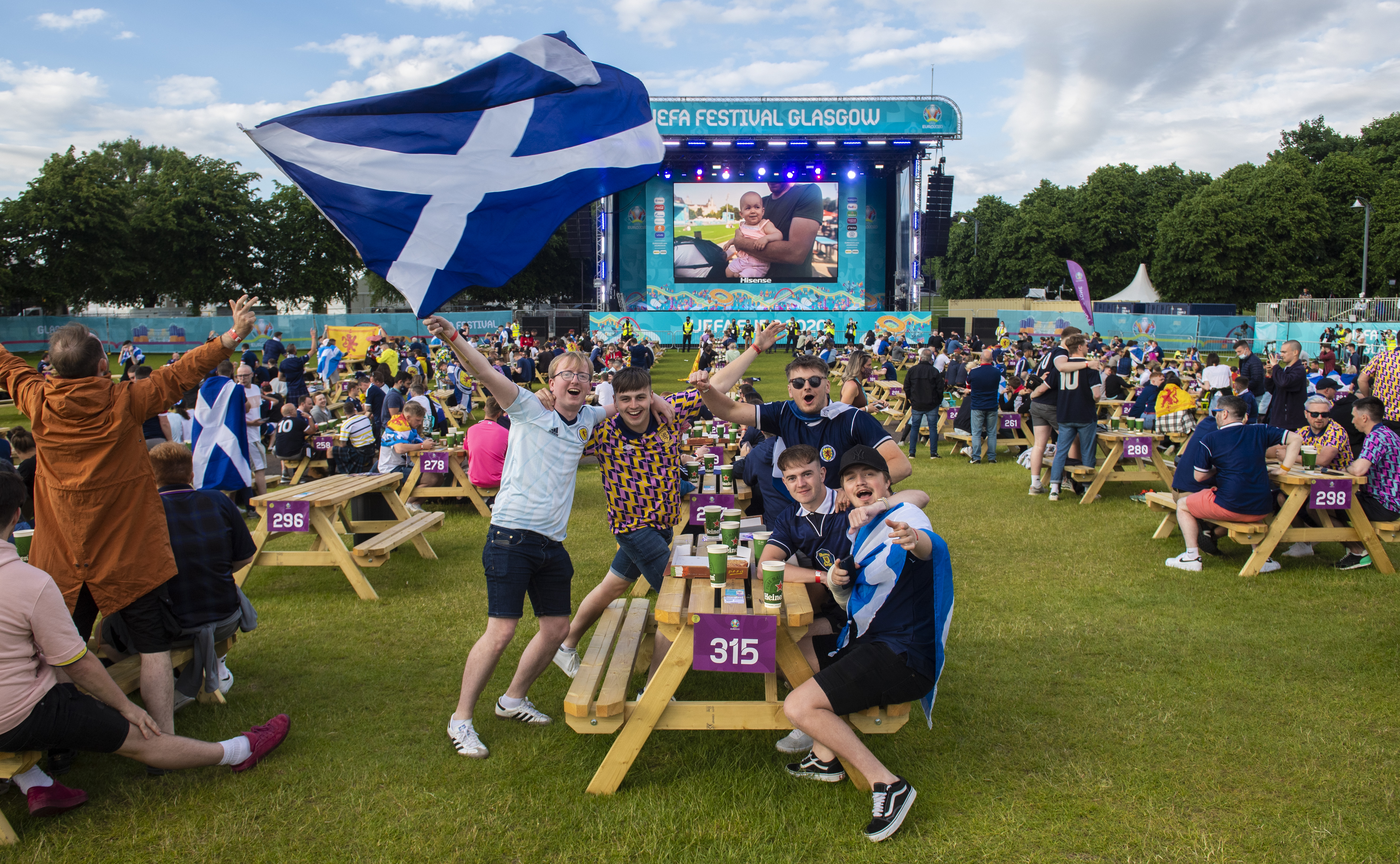 Home support: Scots watch the game at Glasgow's fan zone.