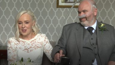Man battling MND marries partner who has been by his side