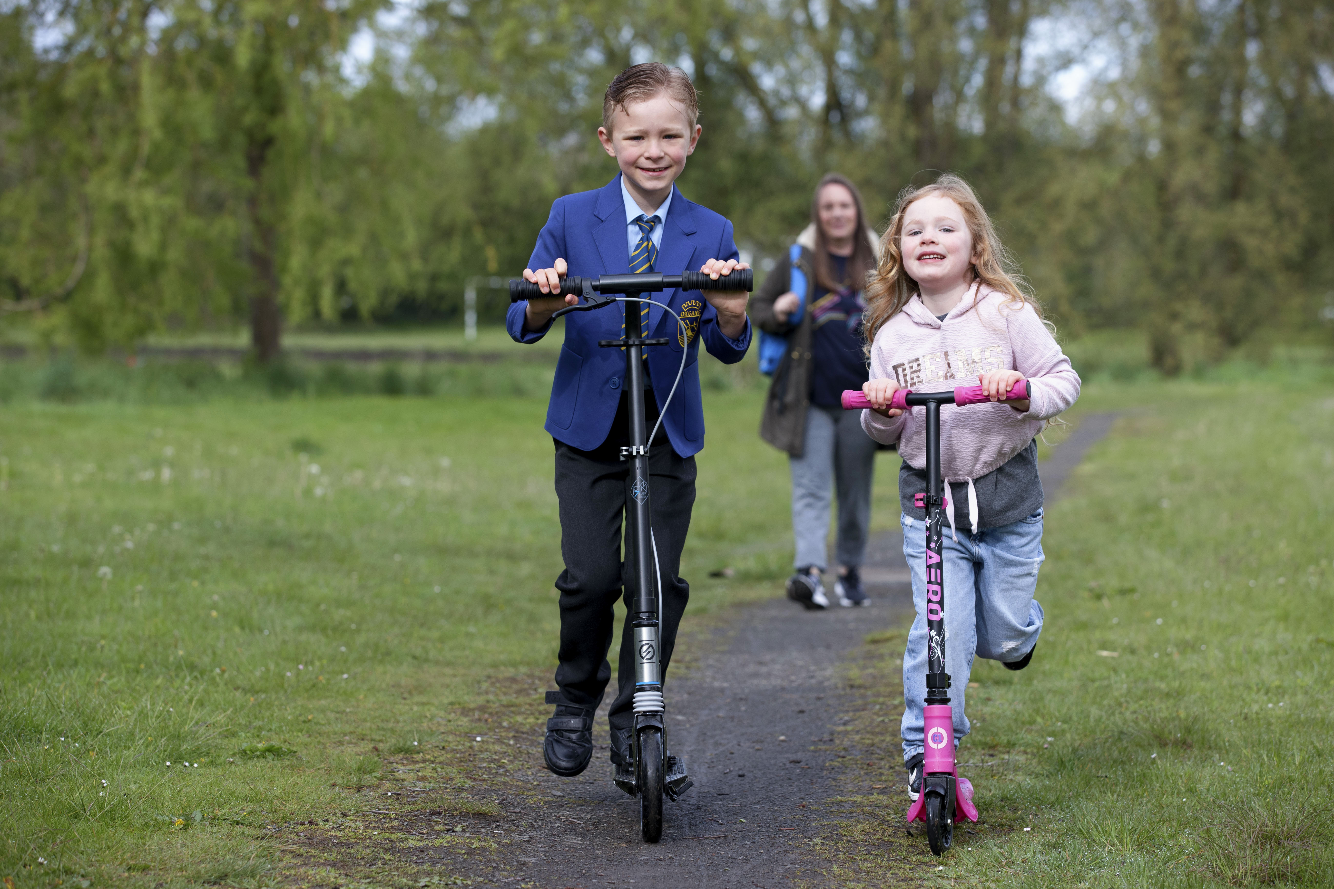 Dylan loves going out on his scooter with little sister Rebecca.