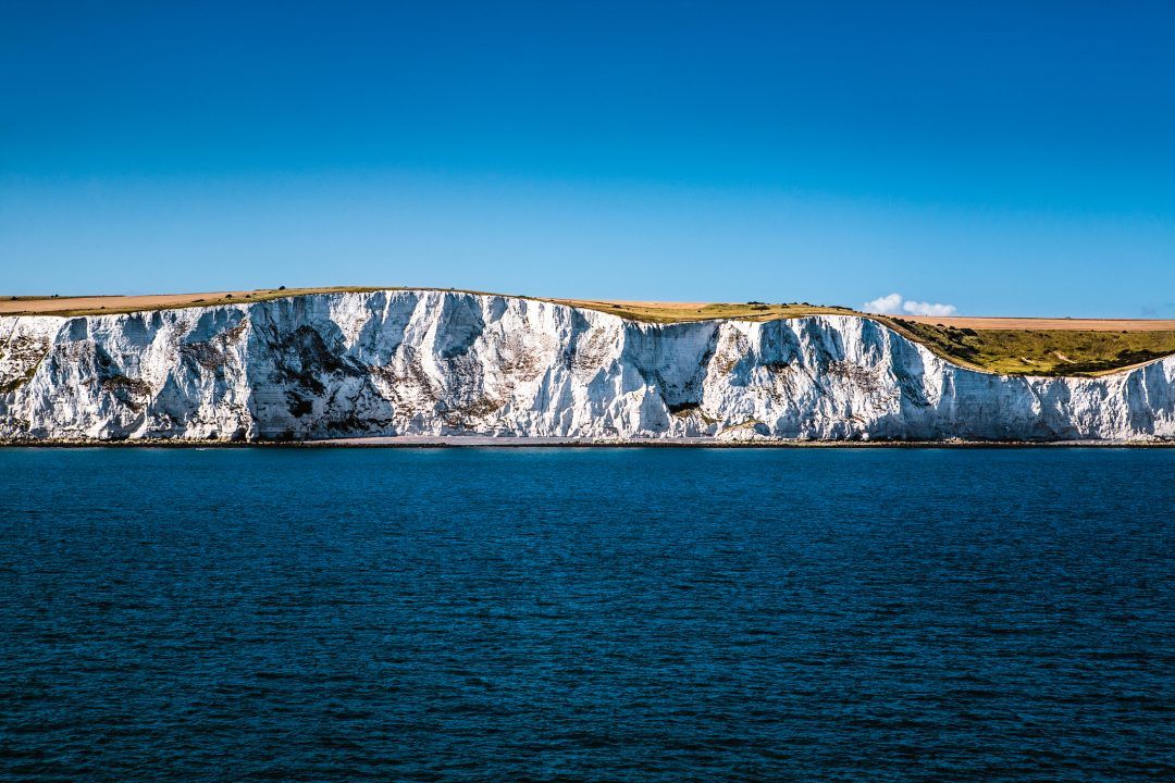 Man dies after jumping from sinking boat in English Channel