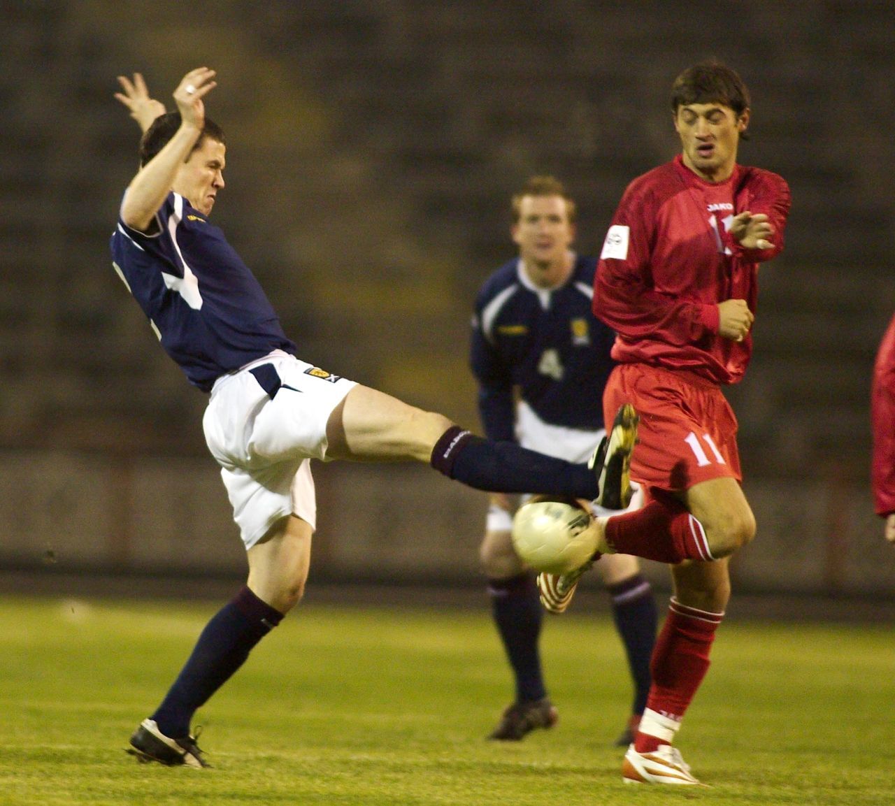 Gary Caldwell challenges Moldova goalscorer Serghei Dadu for possession. 