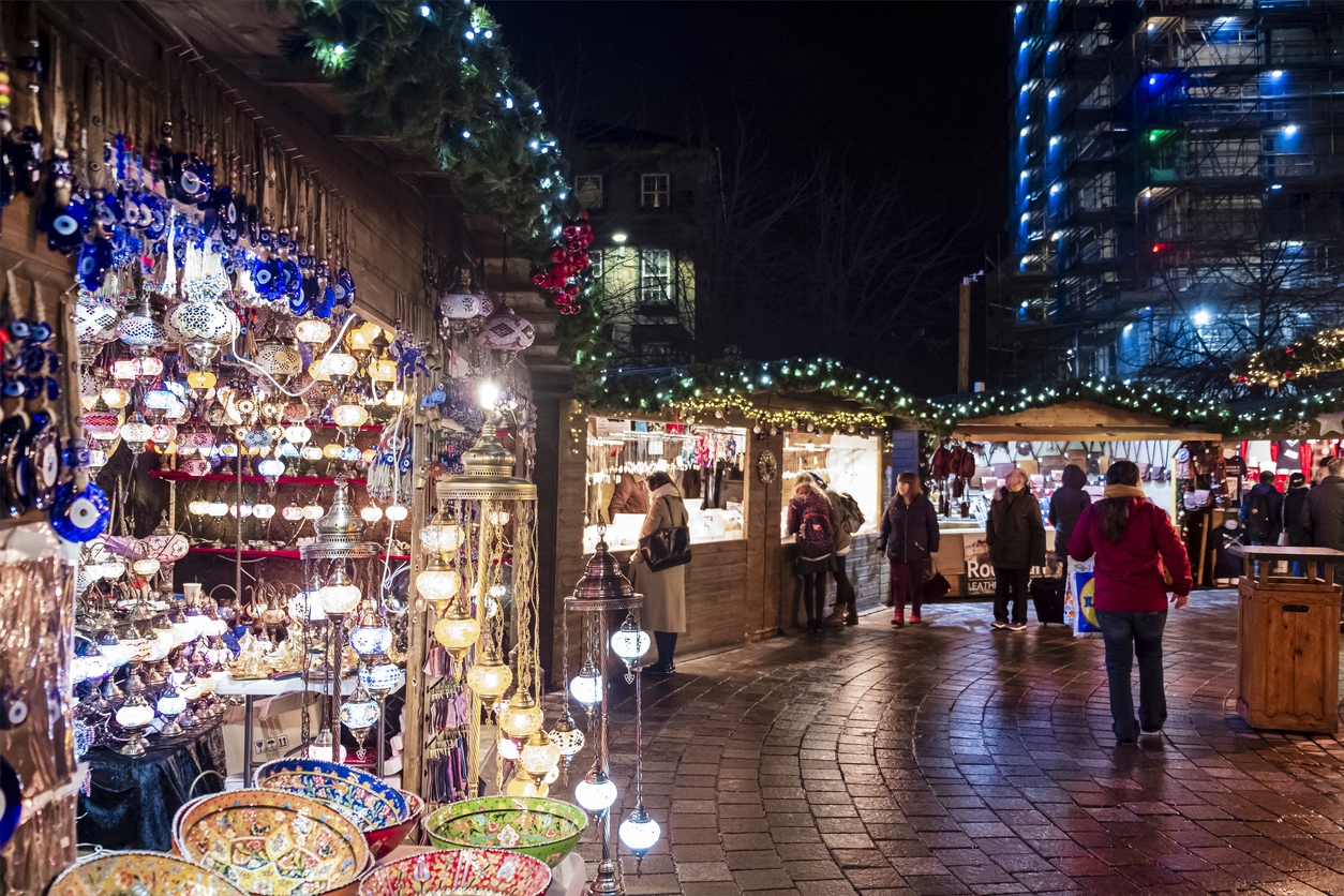 People at the Christmas Market set up in St Enoch Square, a public square in Glasgow.