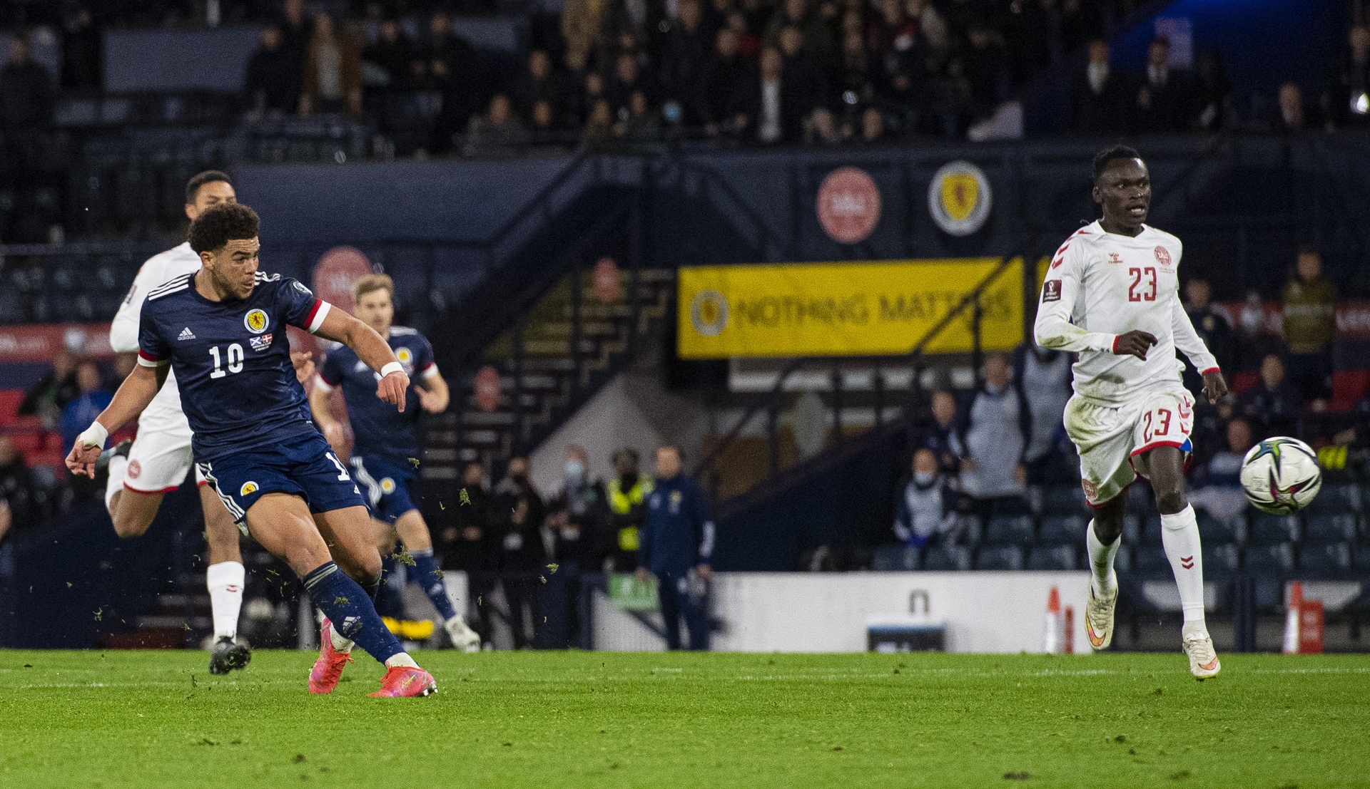Che Adams sealed a sensational night for Scotland by racing clean through with five minutes to go before curling the ball beyond Kasper Schmeichel.