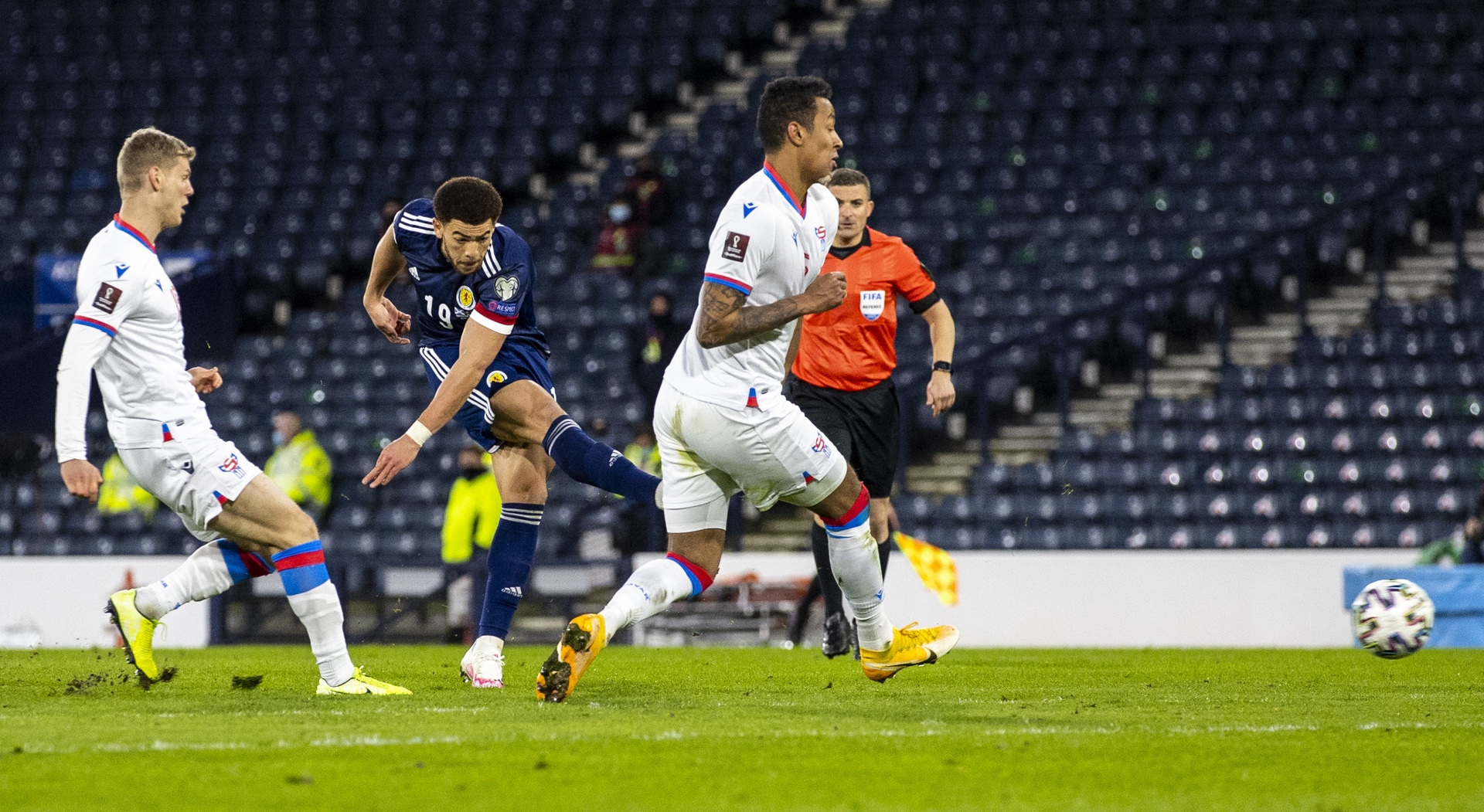 Che Adams capped an impressive first start for Scotland by driving home from the edge of the box - making sure the three points were staying in Glasgow.