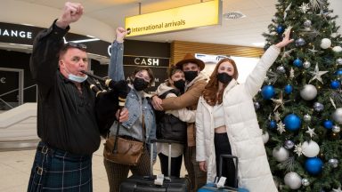Dad pipes home son’s arrival after more than two years apart