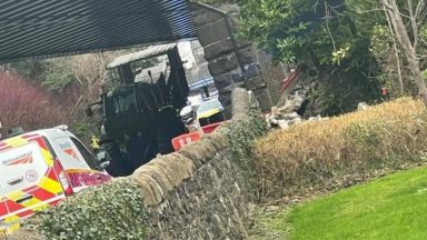 Woman charged after tractor gets stuck under railway bridge