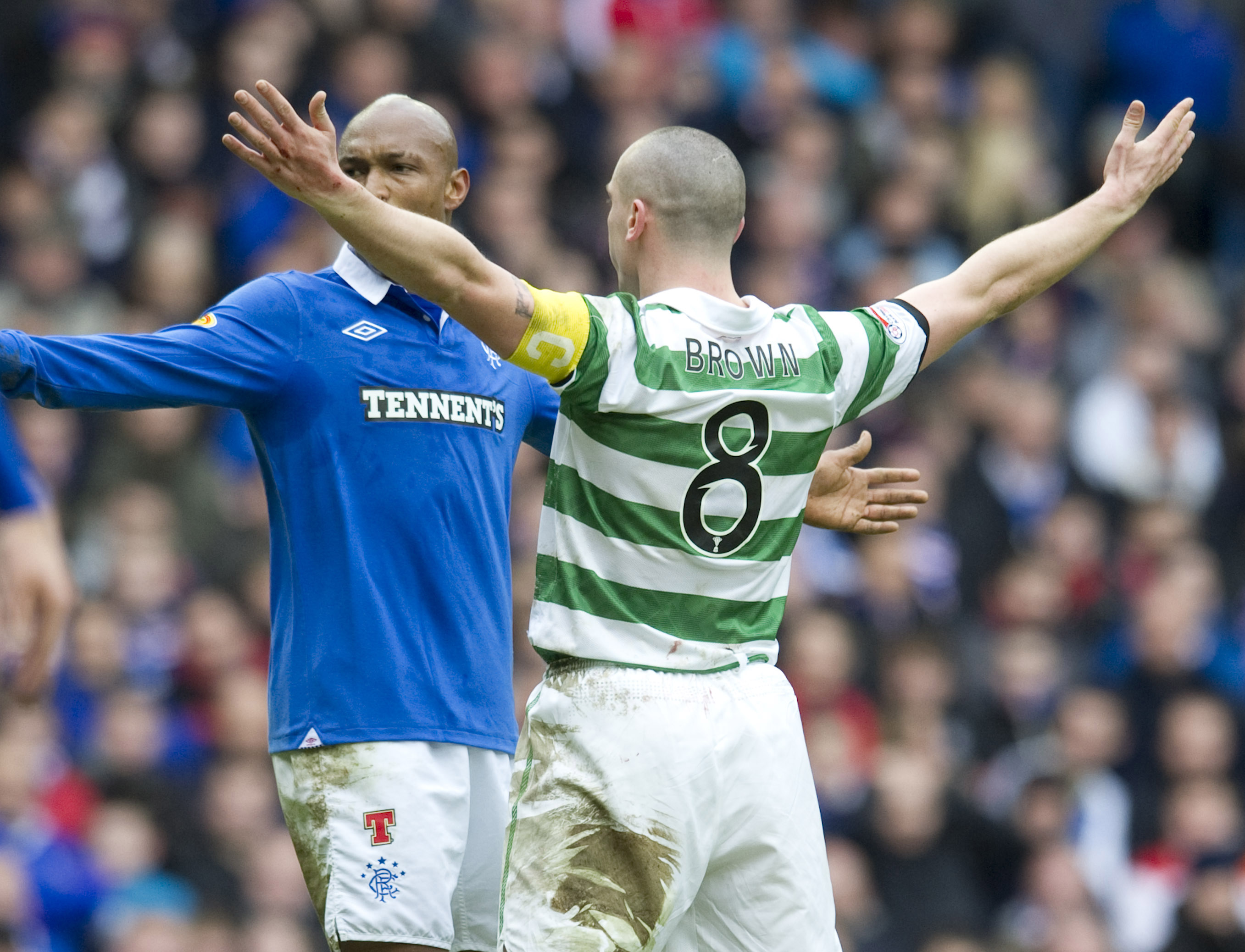 Scott Brown celebrated in front of El Hadji Diouf during an Old Firm clash. (SNS Group)