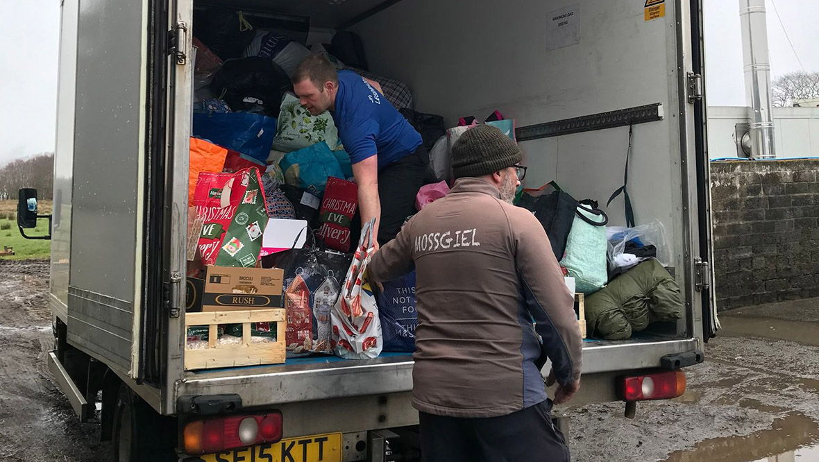 Aid bound for Ukraine being loaded onto a truck at Mossgiel Farm. 