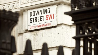 Arrest made after car crashes into gates of Downing Street with armed police on scene