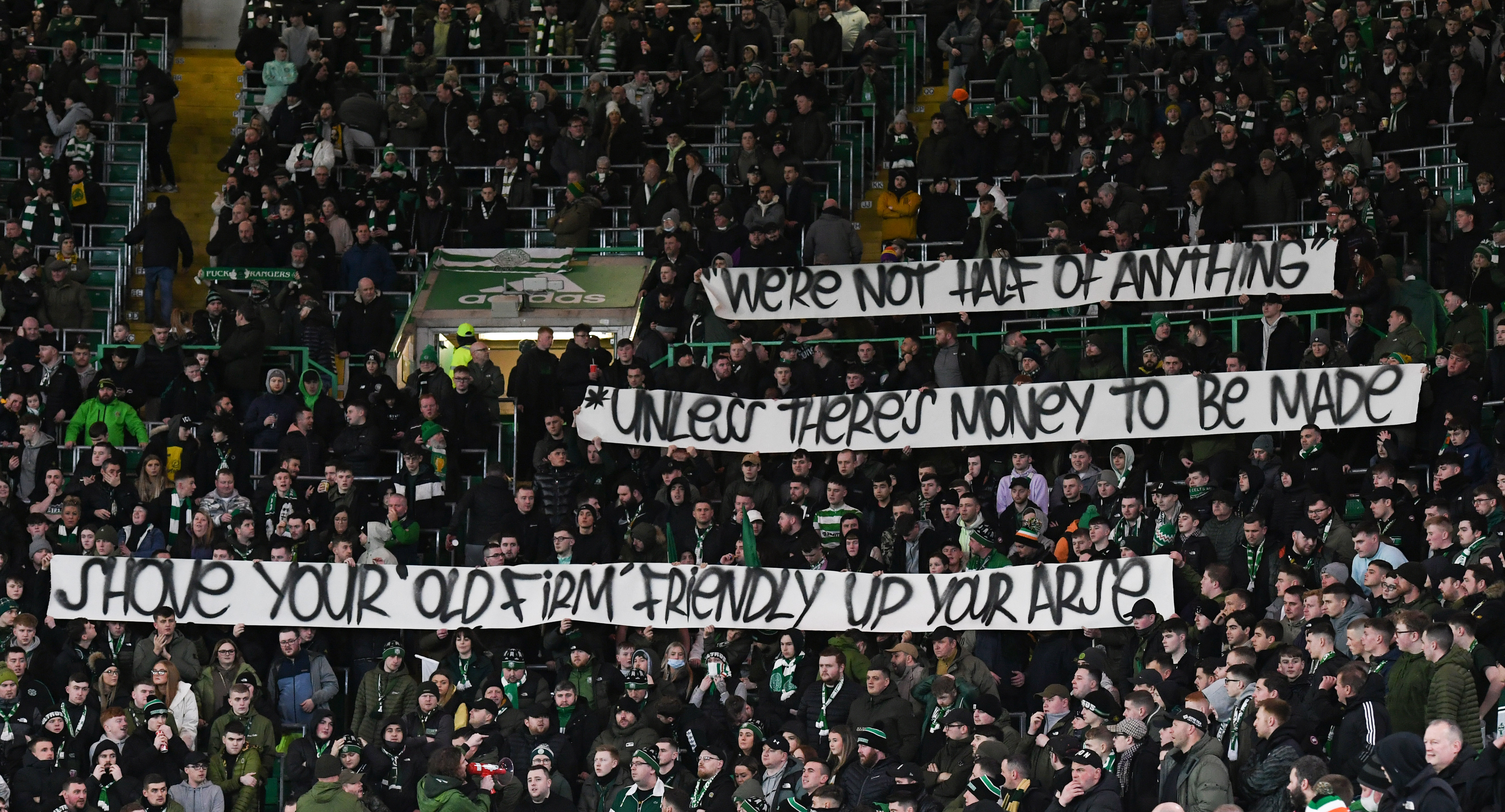 GLASGOW, SCOTLAND - MARCH 02: Celtic fans banner against a proposed Australian Old Firm friendly during a Cinch Premiership match between Celtic and St Mirren at Celtic Park, on March 02, in Glasgow, Scotland.  (Photo by Ross MacDonald / SNS Group)