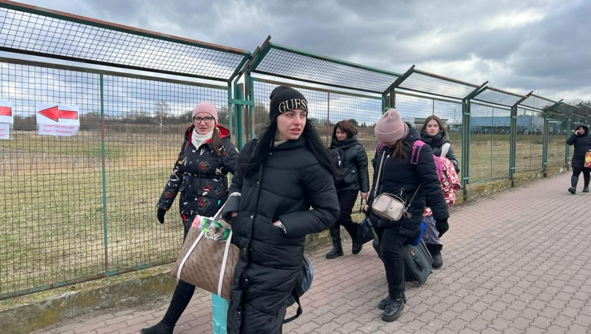 Ukrainians arrive in Medyka, Poland, after fleeing Russia invasion.