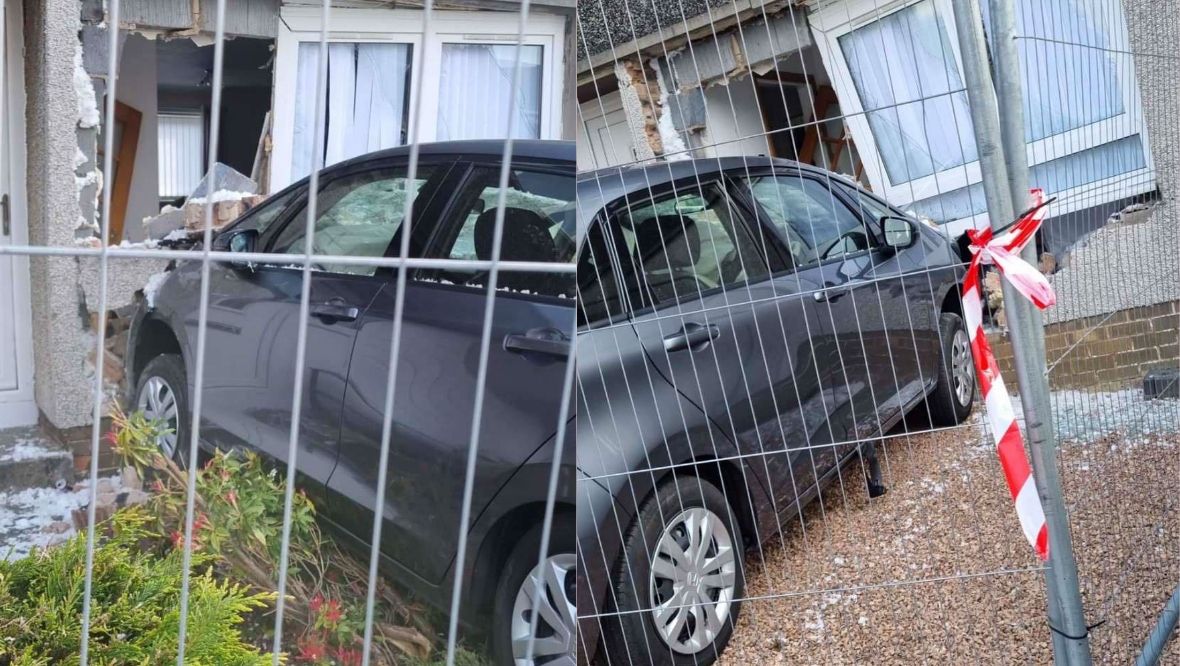 The car crashed into the front of the house. 