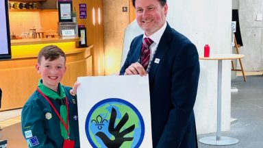Young boy designs badge for Scout and Cubs human rights challenge