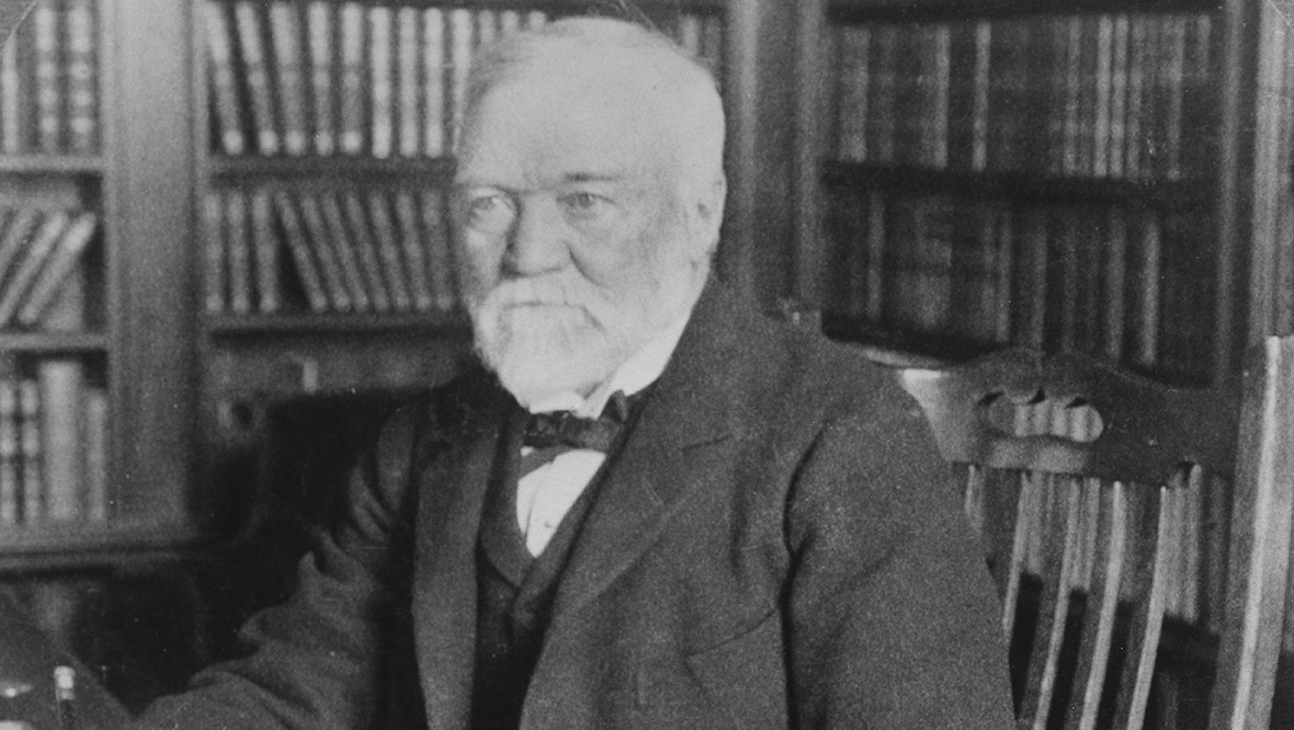 A portrait of Scottish-American industrialist Andrew Carnegie in the library of his home in New York city, circa 1906.  
