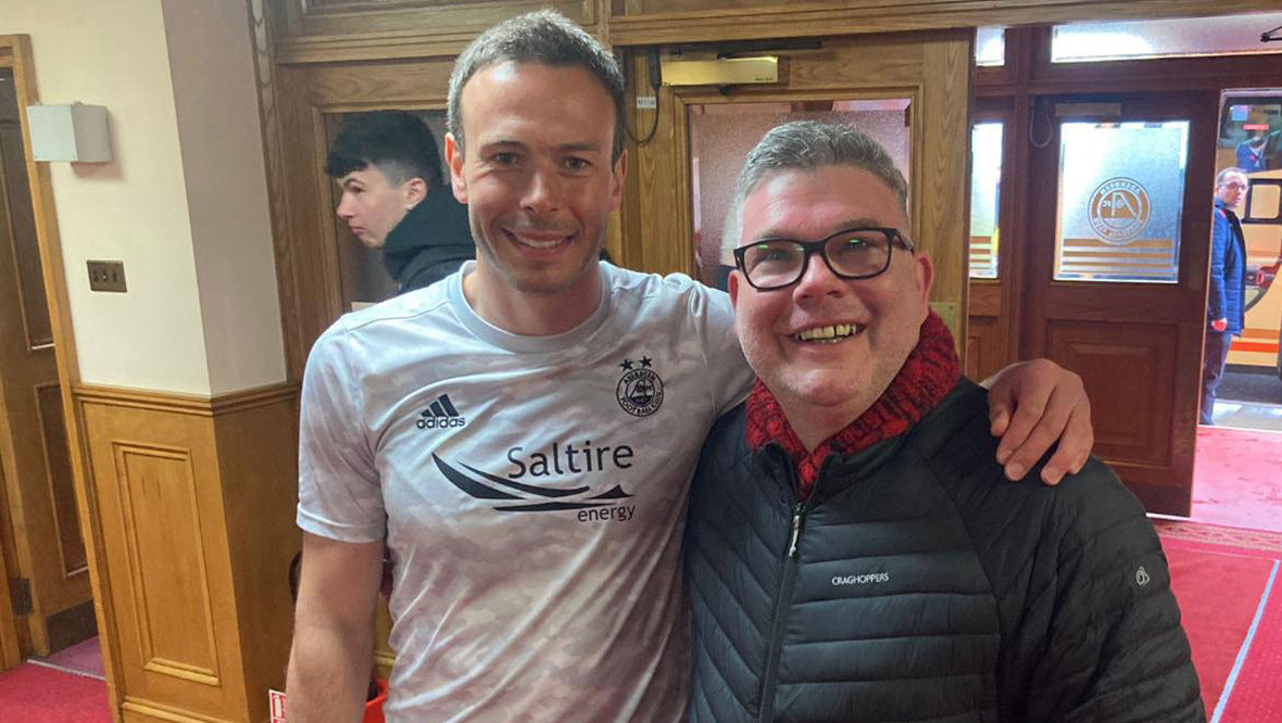 Scott Rennie with Aberdeen defender Andrew Considine at Pittodrie.