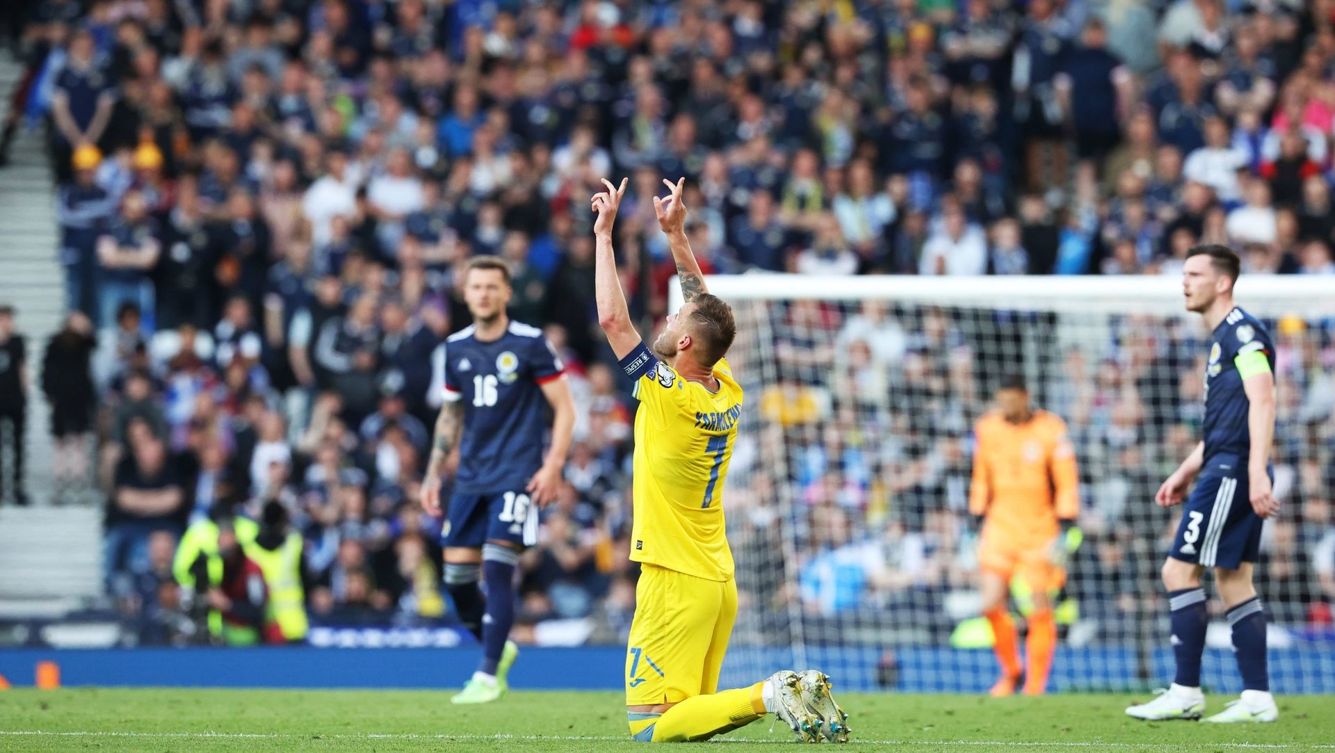 Andriy Yarmolenko celebrates making it 1-0 to Ukraine.