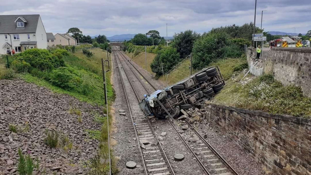 Lorry smashes through stone wall and crashes onto rail tracks in East Lothian disrupting cross-border LNER and LUMO trains