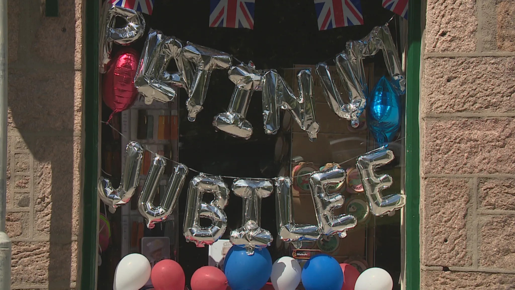 The village of Ballater in Aberdeenshire was decked out in decorations to make the occasion.