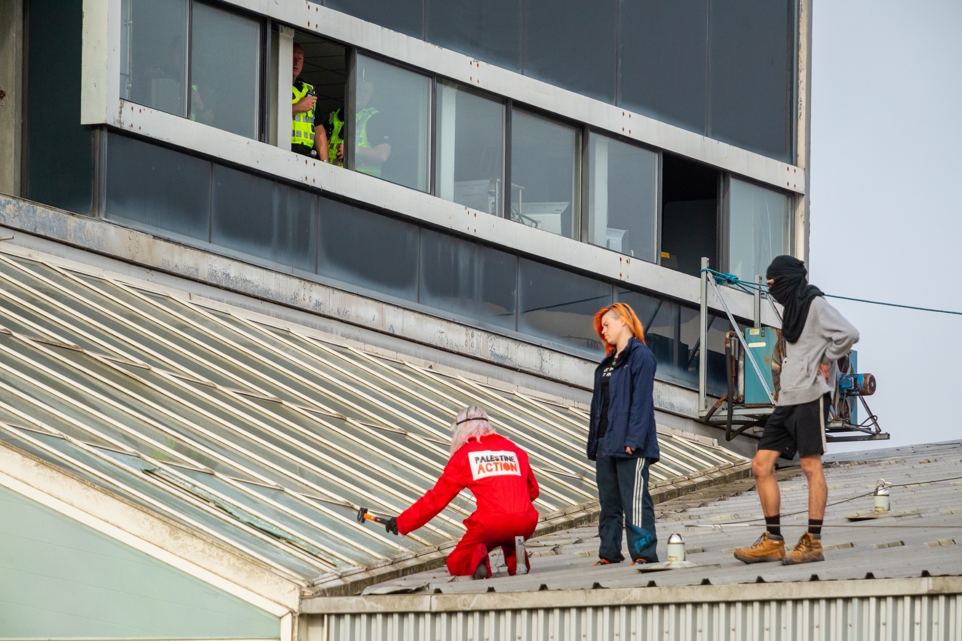 The group of four activists scaled the roof early Monday morning.