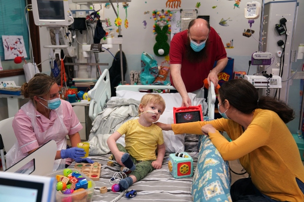 Three-year-old Ethan Mains from Glasgow, with mother Alexa Ispas, right, and father Stuart.