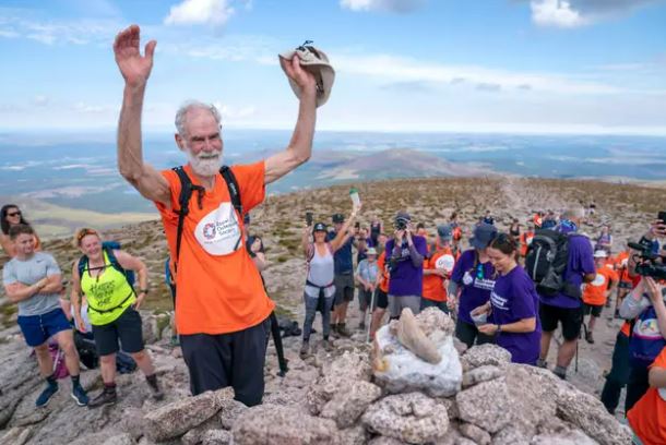 Nick Gardner celebrates reaching the summit (Jane Barlow/PA)