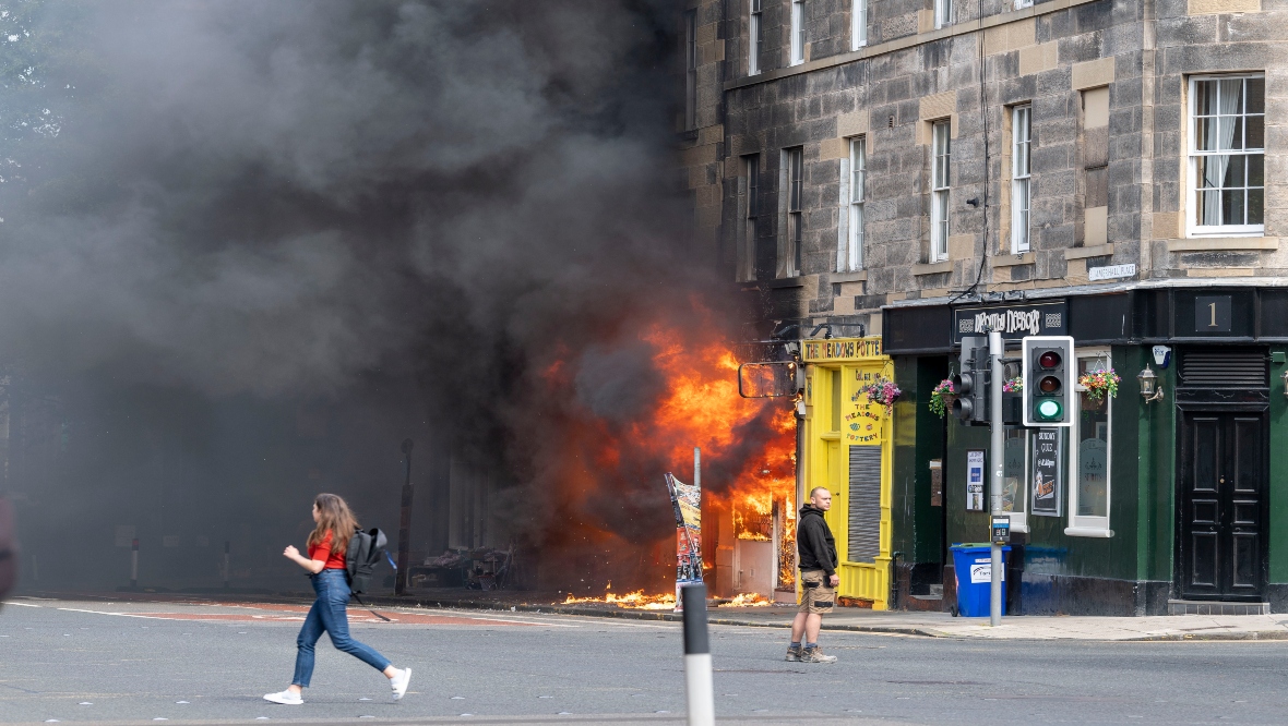 The shop is on the ground floor of a tenement building containing dozens of flats. 