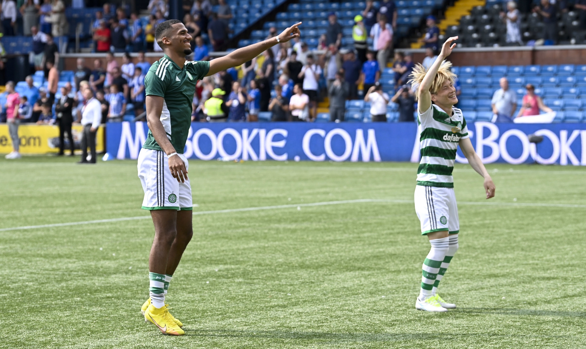 Celtic players celebrate with fans following 5-0 win.