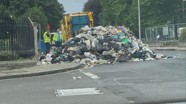 Bin lorry empties rubbish outside police station after fire onboard in Kirkcaldy