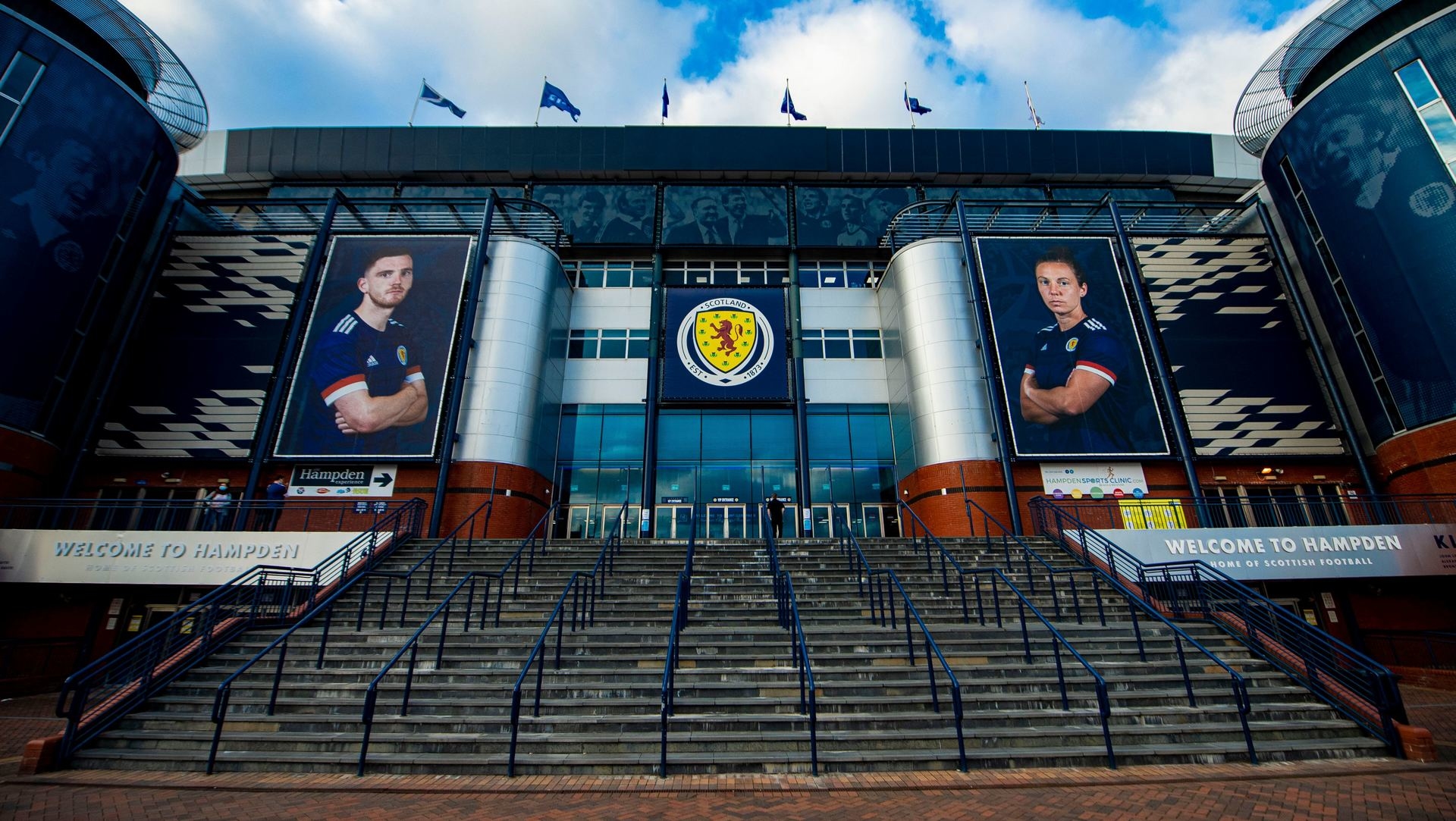 Images of Scotland captains Andy Robertson and Rachel Corsie adorn the entrance to Hampden Park.